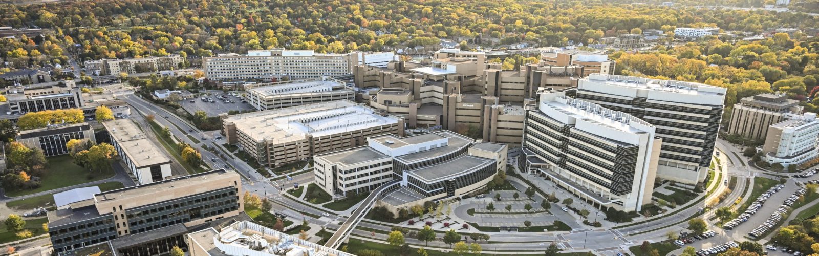 The medical complex on the west side of campus featuring UW Hospitals and Clinics is pictured in an aerial view of the University of Wisconsin–Madison campus during a sunny autumn day on Oct. 22, 2023. Clockwise from bottom, major campus buildings include the Nielsen Tennis Stadium, Rennebohm Hall, Signe Skott Cooper Hall, the Health Sciences Learning Center, University Hospital, Wisconsin Institutes for Medical Research and the Waisman Center. The aerial photograph was made from a helicopter looking southwest. (Photo by Jeff Miller / UW–Madison)