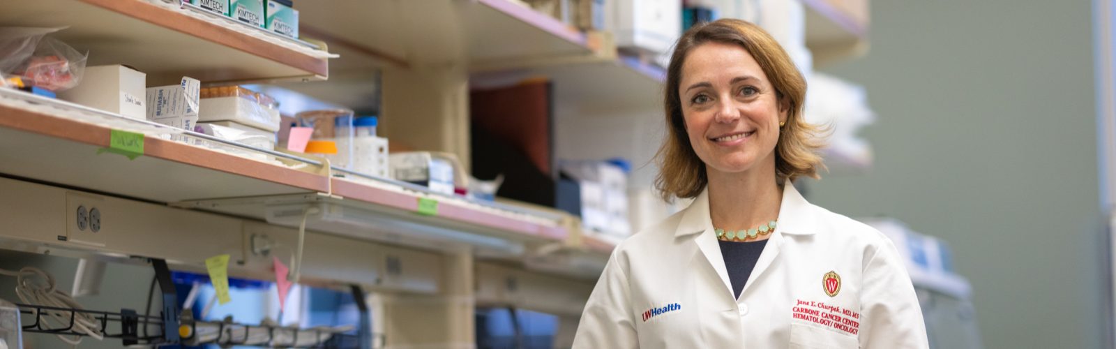Dr. Churpek stands in her laboratory space.
