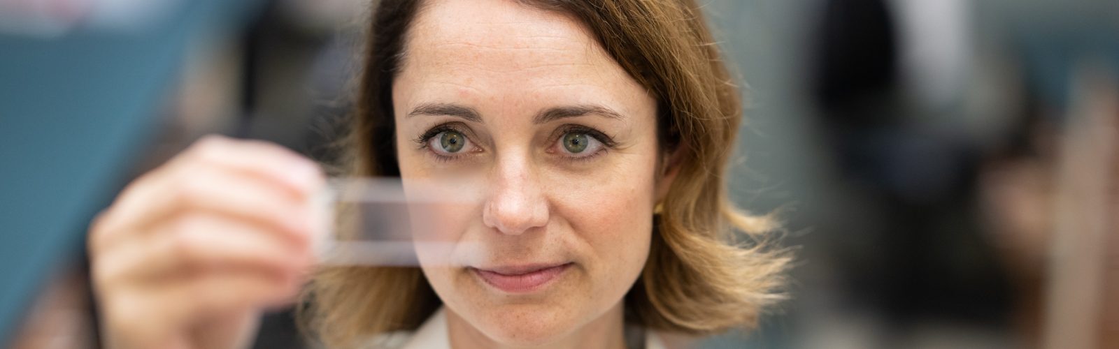 Dr. Churpek analyzes a microscope slide.