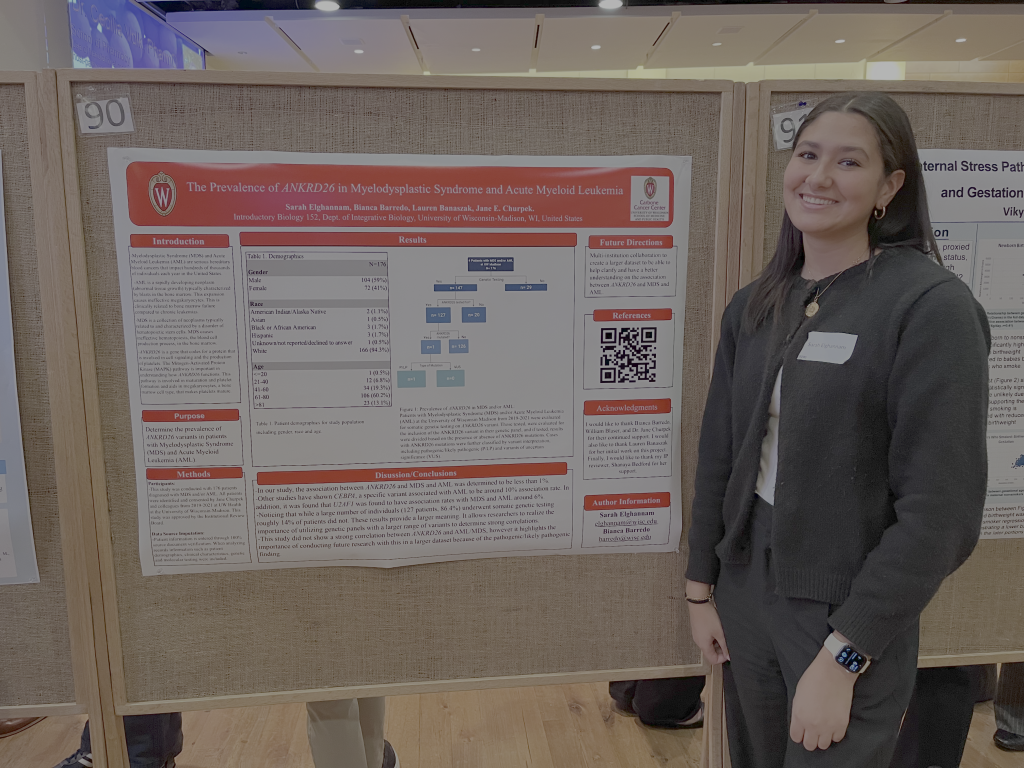 Sarah presenting her poster at the Fall 2025 Bio 152 Symposium.